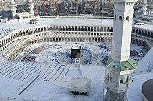 Prayer and Tawaf of Muslims Around AlKaaba in Mecca, Saudi Arabia photo