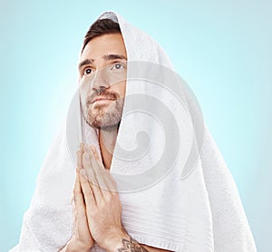 Prayer, thinking and worship with man and towel for hope, spiritual and Catholic faith. Respect, religion and Holy