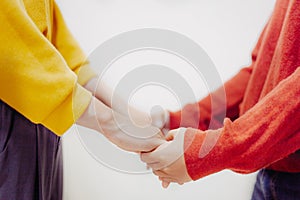 Prayer together and holding hands.