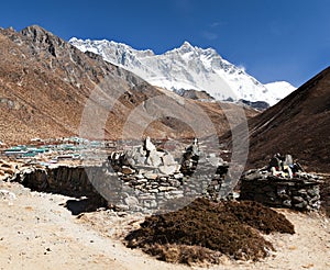 Prayer walls and Dingboche village with mount Lhotse
