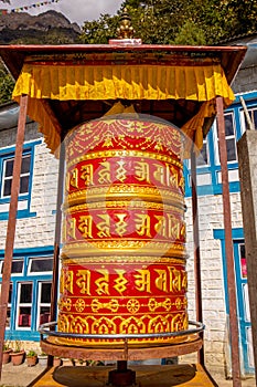 Prayer wheel in buddhist country Om Mani Padme Hum mantra