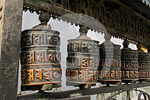 Prayer wheel in Nepali near the Buddhist temple