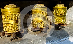 Prayer wheel in Nepali near the Buddhist temple