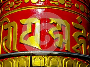 Prayer wheel in Nepali near the Buddhist temple