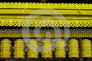 Prayer wheel in Nepali near the Buddhist temple