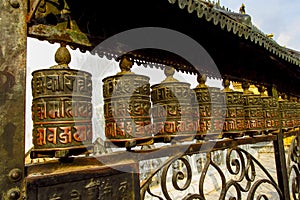 Prayer wheel in Nepali near the Buddhist temple