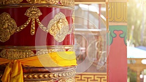 Prayer wheel rotating Thikse Monastery, Leh,Ladakh, India.Traditionally, the mantras are written in Sanskrit on the outside of the