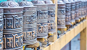 Prayer wheels in the buddhist temple