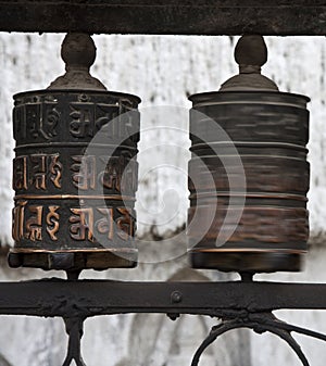 Prayer wheels with Chenrezig mantra, Nepal photo