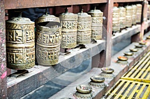 Prayer wheels in the courtyard of Kwa Bahal or Golden Temple  Patan  Nepal