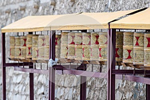 Prayer wheels near the upper temple in Tibet.