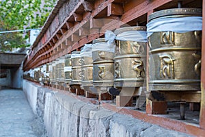 Prayer wheels, prayer's rolls of the faithful Buddhists.Line of