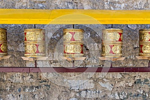 Prayer wheels, prayer's rolls of the faithful Buddhists.Line of