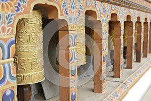 Prayer wheels repeating Buddhist mantra