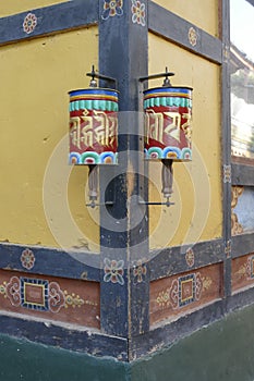 Prayer wheels repeating mantra Om mani padme um