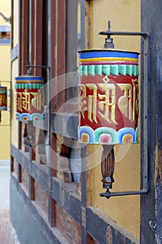 Prayer wheels repeating mantra Om mani padme um