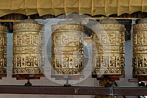 Prayer wheels is spinned by devotees to aid for meditation and accumulating wisdom
