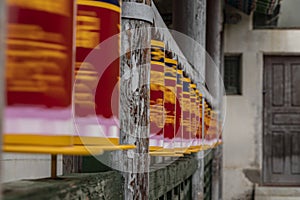 Prayer wheels spinning in a worship buddhist temple in Mongolia