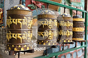 Prayer wheels is spun by devotees
