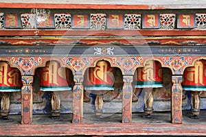 Prayer wheels were installed in the courtyard of a Buddhist temple in Paro (Bhutan)