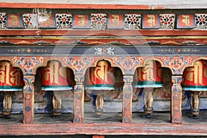 Prayer wheels were installed in the courtyard of Kyichu Lhakhang in Paro (Bhutan)