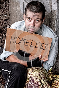 Prayerful eyes of homeless woman
