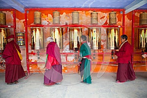 Prayers whirling prayer wheel in the Sertar buddhish college