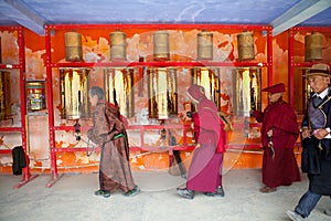 Prayers whirling prayer wheel in the Sertar buddhish college