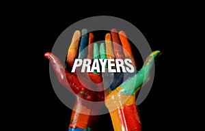 Prayers word concept on Multi Colors Painted hand