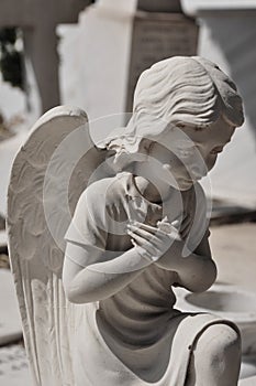 Praying angel statue