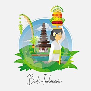 Praying balinese woman with temple background