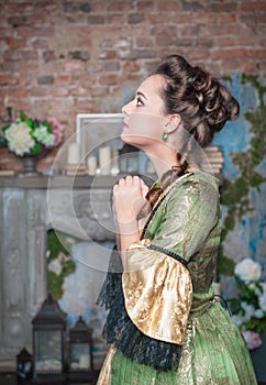 Praying beautiful woman in medieval dress