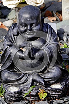 Praying Black Buddha ornament.