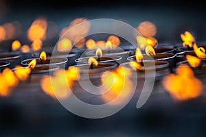 Praying candles burning in a temple