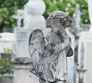 Praying concrete angel cemetery