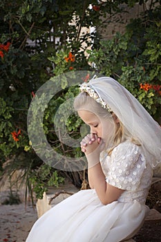 Praying girl first holy communion