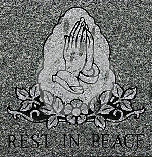 Praying hands etching with Rest in Peace inscription