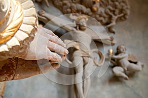 Praying hands with jesus christ on cross in background