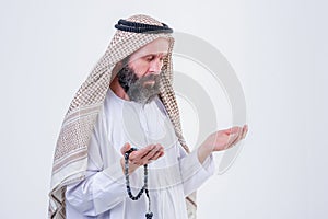 Praying hands of an old arabic man.Indoor picture