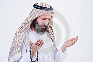 Praying hands of an old arabic man.Indoor picture