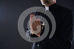 Praying hands priest portrait of male
