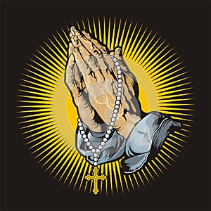 Praying hands with rosary and shining photo