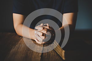 Praying hands of teen girl