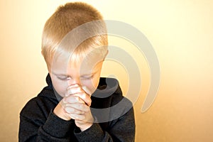 Praying little child (boy), christianity, religion