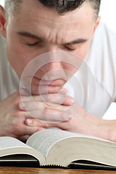 Praying man with the Bible