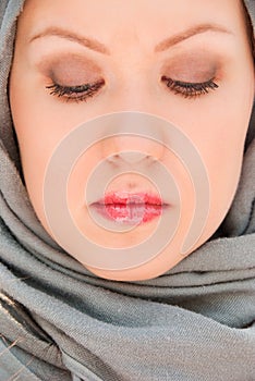 Praying moslem woman close-up portrait