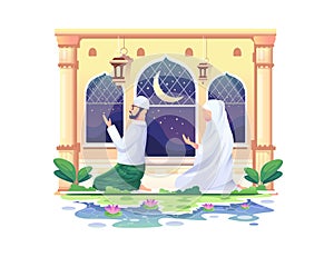 Praying Muslim couple at a mosque in Ramadan Kareem, happy eid Mubarak