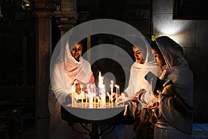 Praying nuns in Church of the Holy Sepulchre,  in Old City East Jerusalem