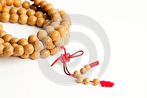 Praying and reciting wooden beads