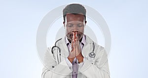 Praying, stress and black man doctor with anxiety, burnout and worry from surgery in studio. Healthcare, medical and